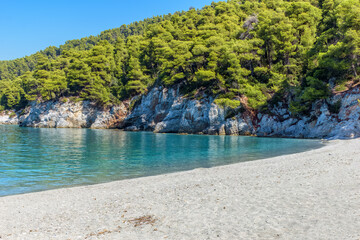 The famous pebble beach kastani with the turquoise waters where the famous Mamma Mia movie was filmed, located in Skopelos island, Sporades, Greece. - obrazy, fototapety, plakaty