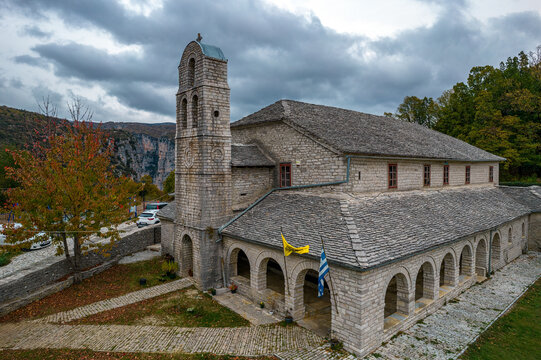Aerial view of Agios Athanasios stone built  church during  fall season in the stone  village Monodendri central Zagori Greece