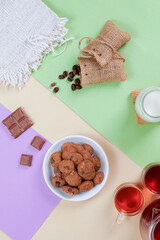 chocolate cookies or snacks with milk chocolate ingredients in a photo with a full color minimalist concept