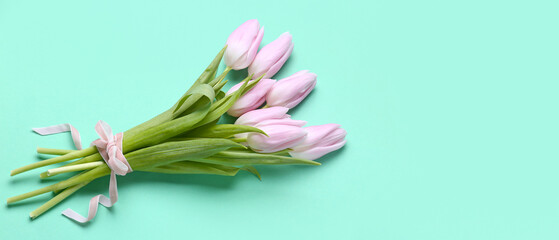 Bouquet of beautiful tulip flowers on color background with space for text