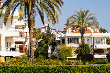 Side, Turkey -January 21, 2023:  Colorful Turkish streets with low houses,   palms