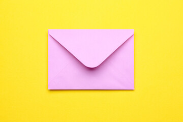 Pink envelope on yellow background