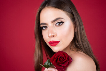 Studio portrait of young beautiful woman with roses. Youth and skin care concept. Valentines day. Holiday birthday day. No filter unaltered face.