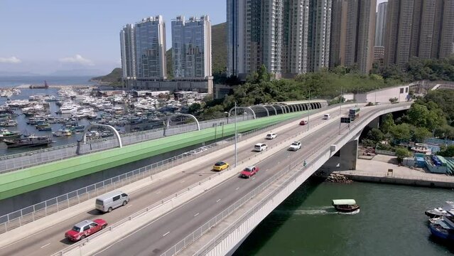 Aerial view of the bridge in Aberdeen Hong Kong. Taxis and cars moving. Hong Kong harbour, popular travel destination in Asia. China. 