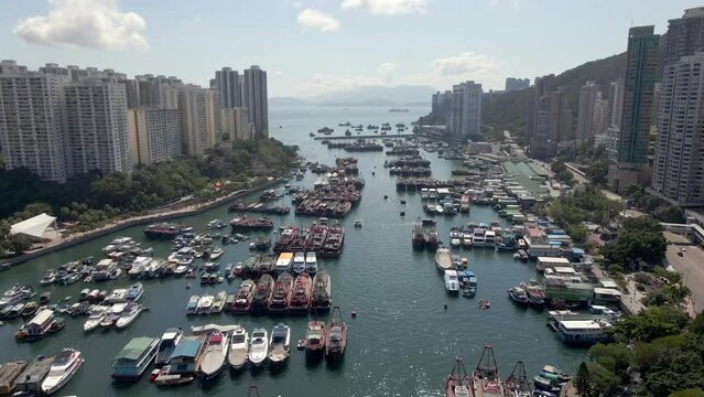 Hong Kong harbour in Aberdeen drone view. Boats, ferries and yachts. A popular tourism destination in Asia. China. 