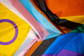 Rainbow LGBTQIA flag made from silk material. Happy pride month. Symbol of LGBTQ pride month. Equal rights. Peace and freedom. Support LGBTQIA community. Diversity equality