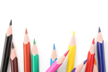 Set of colorful pencils on white background, top view