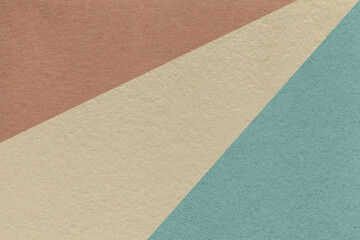 Texture of old craft beige, blue and dark brown color paper background, macro. Vintage abstract cerulean cardboard.