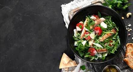Chicken breast and fresh vegetable salad.