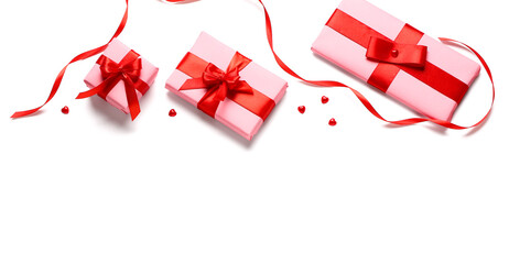 Composition with gift boxes and ribbon on white background. Valentine's Day celebration