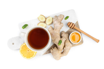 Board with ginger root, cup of black tea, honey and lemon isolated on white background