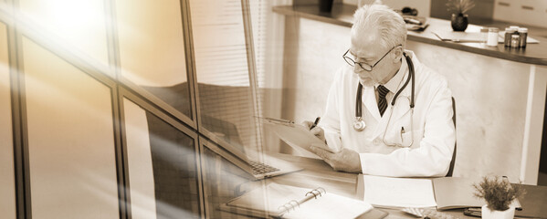 Senior doctor taking notes on clipboard; multiple exposure