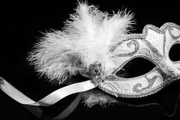 Carnival mask for Mardi Gras celebration on dark background, closeup