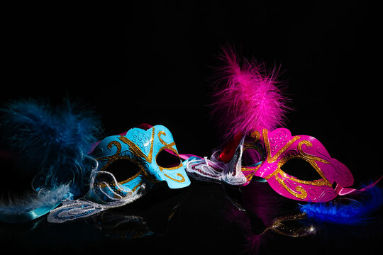 Carnival masks for Mardi Gras celebration on dark background
