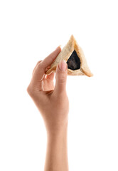 Woman with Hamantaschen cookie for Purim holiday on white background