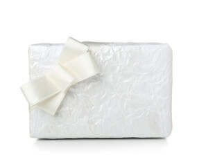 Gift box with silk bow on white background