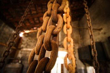 rusty iron chains in an industrial factory