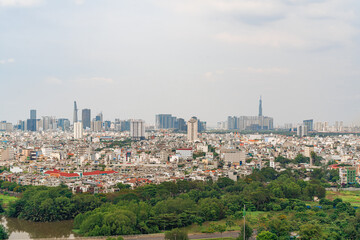 Obraz premium Ho Chi Minh city, Vietnam - 20 Jan 2023: View from District 7 to the city center. See Bitexco tower and Landmark 81, IFC One,... famous towers in Vietnam. One of the developed cities in Vietnam.