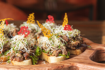 Real italian brucheta,sicilian food, fresh snack in Sicily, italian kitchen,sicilian kitchen, Italian Appetizer Bruschetta with tomatoes, tuna, garlic and herbs