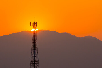 Telephone tower, radio tower during sunset. Telecommunication Tower for 2G 3G 4G 5G network,...