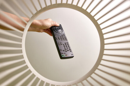 The old remote control is discarded and recycled in the trash. View from below. The concept of recycling and disposal.