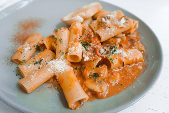 Pennette alla boscaiola - mushrooms tossed with pasta in a silky garlic-herb tomato cream sauce.