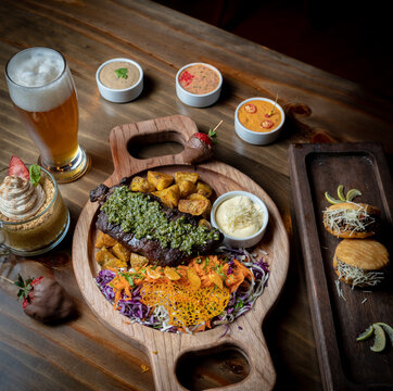 table of meat and grilled achuras