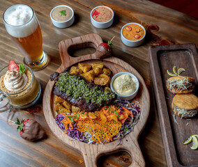 table of meat and grilled achuras