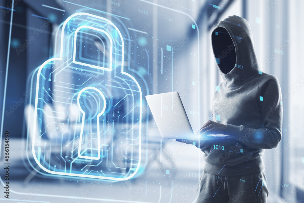Poster hacker in hoodie using laptop with glowing padlock hologram on blurry office interior background. se