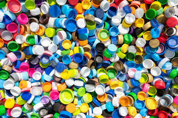 Fototapeta na wymiar Colorful plastic caps lay on the floor.
