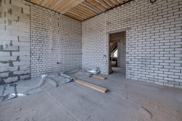 empty interior in house without repair with white silicate brick walls