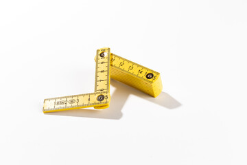 A carpenters ruler on white background