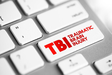TBI Traumatic Brain Injury - intracranial injury to the brain caused by an external force, acronym text concept button on keyboard