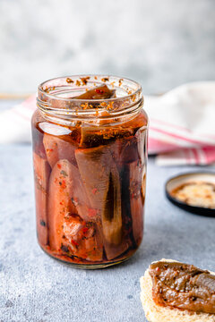 Homemade pickled eggplant preserved in glass jar kept on table