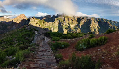 Landscape of sunrise in mountain over clouds in Madeira Island on Pico do Arieiro canyons and...