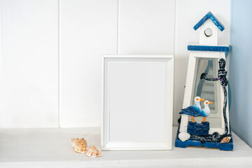 Portrait white picture frame mockup with sea decorations 