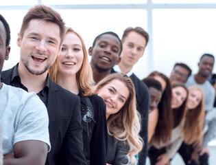 close-up . young woman standing in front of a group of young people