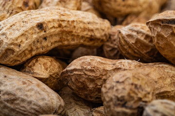 Peanuts in shell isolated on white background. Heap of peanuts close up