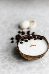 Original handmade decorative aroma candle in coconut. coconut shell, natural soy wax and coffee beans. 