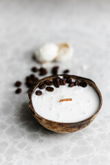 Original handmade decorative aroma candle in coconut. coconut shell, natural soy wax and coffee beans. 