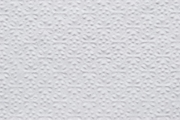 A sheet of white structured white tissue paper as background
