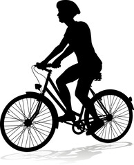 Fototapeta na wymiar Bicyclist riding their bike and wearing a safety helmet in silhouette