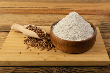 Buckwheat Flour Pile in Wood Bowl, Dry Buck Wheat Powder, Buckwheat Flour on Wooden Rustic Background