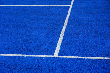 tennis court surface with painted white line markings. Rubber ground material of sports arena....