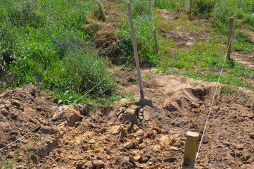 Digging the ground for house garden pathway pavement foundation