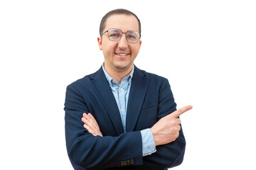 Portrait of a happy businessman in glasses pointing his finger to the side on a white background. Young man in a suit looking at the camera