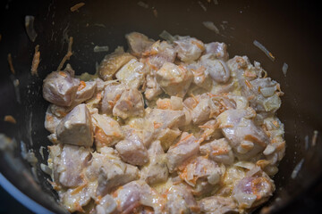 marinated sliced pork pieces cooked and sliced in a barbecue bowl