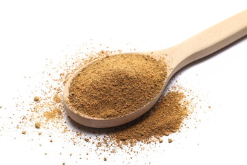 Tikka masala spice powder mix, coriander, cumin, garlic, red pepper chili, mint, black pepper and ginger in wooden spoon isolated on white