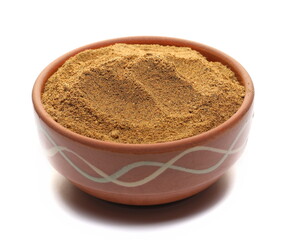 Tikka masala spice powder mix in clay pot, coriander, cumin, garlic, red pepper chili, mint, black pepper and ginger isolated on white