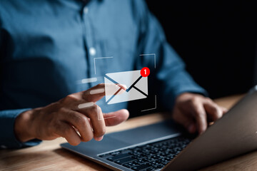 Businessman sending email by laptop computer to customer, business contact and communication, email icon, email marketing concept, send e-mail or newsletter, online working internet network. - obrazy, fototapety, plakaty